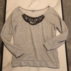 Grey sweater with beading on neckline